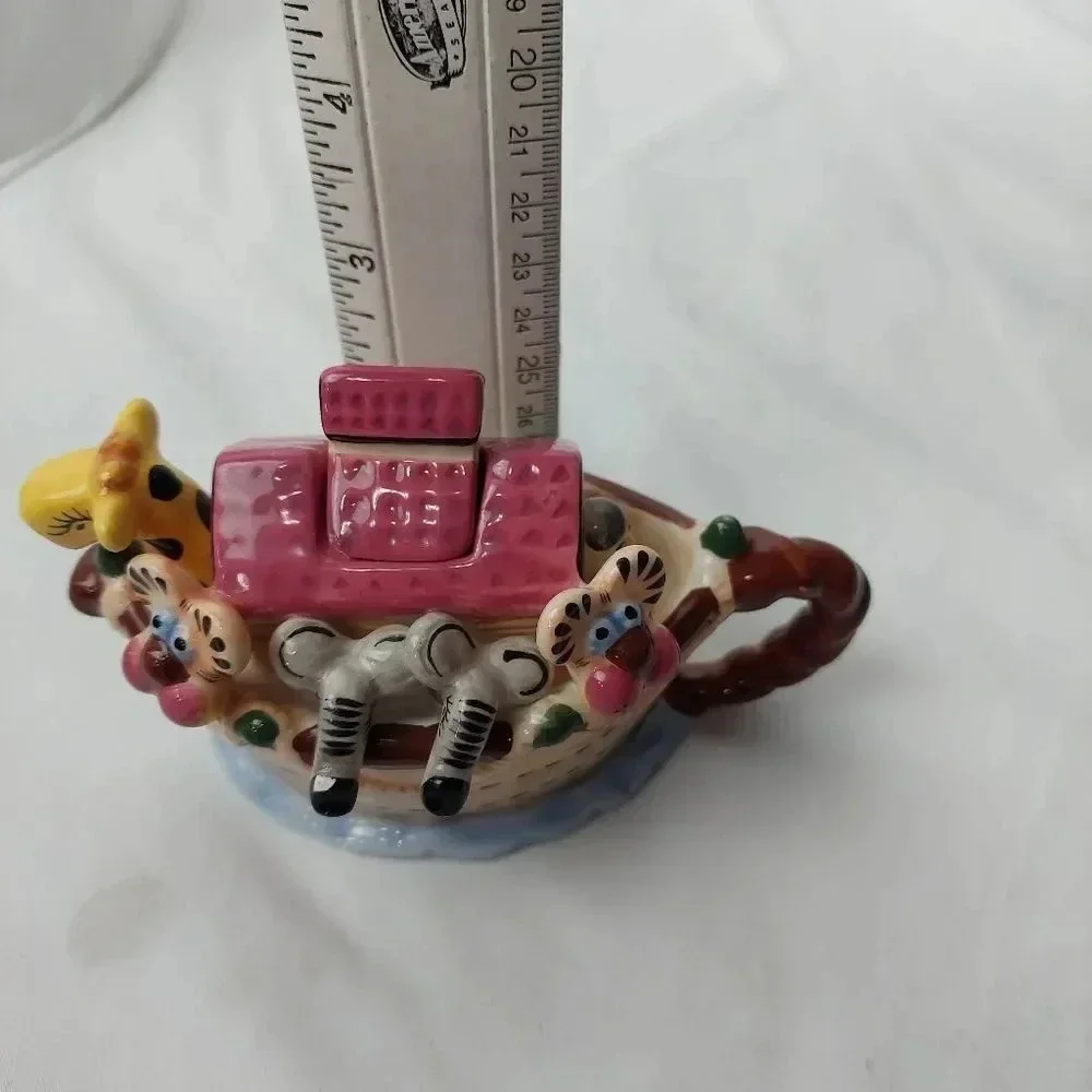 vintage animals in the boat tea pot
